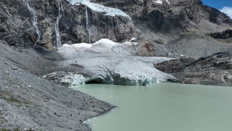 Aerial-Forward-up-Drone-Shot-of-Fellaria's-Glacier-and-its-Oriental-Lake---Valmalenco---Sondrio