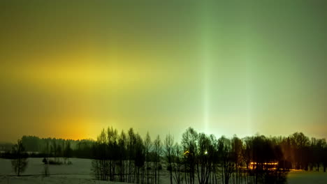 Aurora-borealis-over-a-winter-countryside-farmhouse---colorful-nighttime-time-lapse