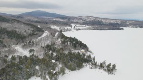 Aerial-footage-of-frozen-lake-and-mountains-in-Maine