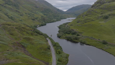 Loch-Eilt-aerial-push-in-above-the-Loch-following-the-road-and-train-line-towards-Glenfinnan