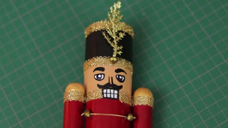 Handmade-toy-solider-christmas-nutcracker-with-glitter-on-cutting-mat