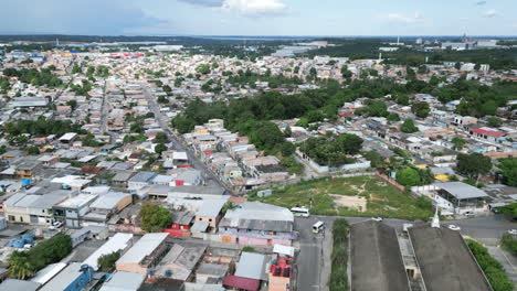 Slow-aerial-pan-across-neighborhoods-in-Manaus,-Brazil