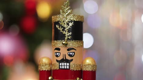 Detail-of-glitter-toy-soldier-nutcracker-on-bokeh-christmas-background