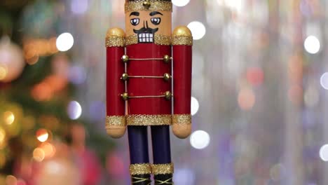 Wooden-toy-soldier-nutcracker-decoration-on-bokeh-christmas-background