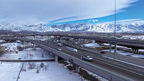 Winterscape-aerial-view-of-traffic-flow-on-Spaghetti-Bowl,-Salt-Lake-City,-Utah