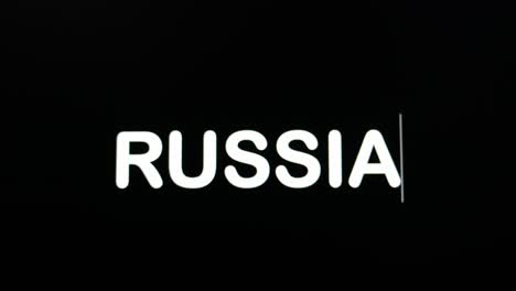 Nahaufnahme-Von-Russland,-Das-In-Den-Computerbildschirm-Eingegeben-Wird,-Mit-Blinkendem-Cursor-Auf-Schwarzem-Hintergrund-Und-Kopierraum