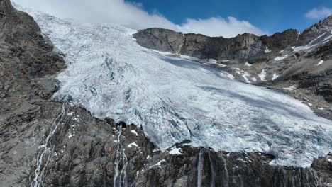 Aerial-Backward-Drone-Shot-of-Fellaria's-Glacier-and-its-Waterfalls---Valmalenco---Sondrio