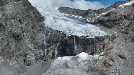 Aerial-Backward-Far-Drone-Shot-of-Fellaria's-Glacier-and-its-Waterfalls---Valmalenco---Sondrio
