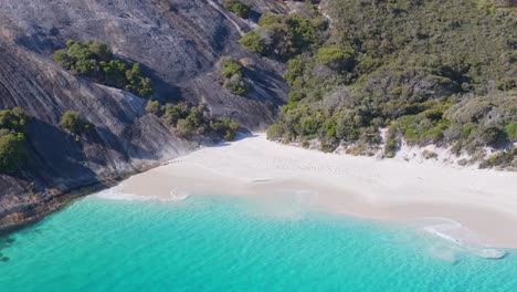 Drone-view-of-white-sand-beach-secluded-in-a-remote-part-of-Australia