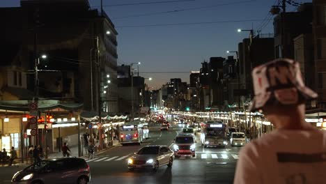 Night-Time-Traffic-Along-Shijo-Dori-Street-In-Gion-At-Night-Viewed-From-Yasaka-Shrine-In-Kyoto