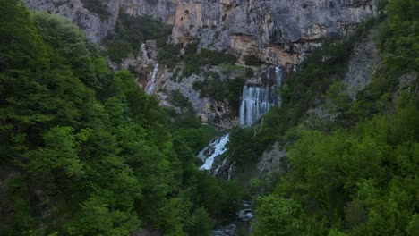 aerial-drone-view-Ujevara-E-Sotires-wild-waterfalls-in-Nivica-Canyon