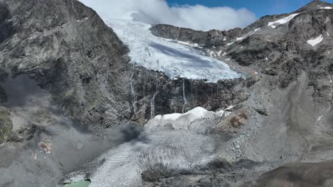 Aerial-pullback-Drone-Shot-of-Fellaria's-Glacier-revealing-Fellaria's-Oriental-Lake---Valmalenco---Sondrio
