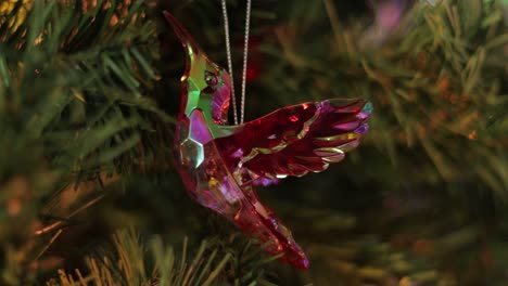 Glittering-iridescent-crystal-hummingbird-decoration-on-christmas-tree