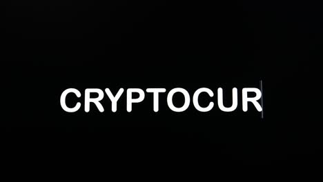 Close-up-of-CRYPTOCURRENCY-being-typed-into-computer-monitor-screen-with-blinking-cursor-on-black-background-copy-space