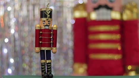 Christmas-toy-soldier-nutcracker,-same-huge-figurine-in-background