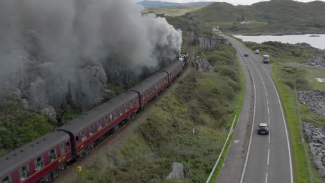 Mallaig-Jacobite-Express-aerial-tracking-shot-of-the-train-leaving-station