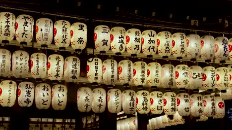 Illuminated-Hanging-Paper-Lanterns-At-The-Buden-Stage-In-Yasaka-Shrine,-Kyoto