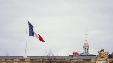 Slow-motion-footage-of-a-large-French-Flag-billowing-back-and-forth-in-the-wind