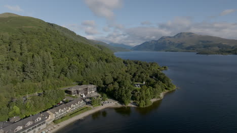 Loch-Lomond-aerial-tracking-shot-above-Luss-heading-North-along-A82-road