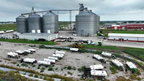 Midwest-USA-industrial-site-with-silos,-tanks,-and-equipment-under-a-cloudy-sky