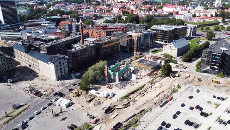 Construction-site-in-Sadama-area-of-Tallinn-with-old-town-in-background,-aerial-view