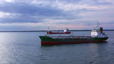 Passenger-Boat-And-Oil-Tanker-Ship-Navigating-Near-Port-of-Balikpapan-In-Kalimantan,-Indonesia