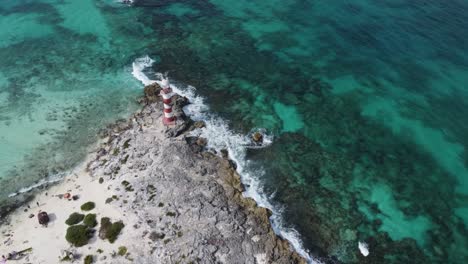 Aerial-high-view-of-Vintage-Lighthouse-on-Caribbean-sea-coast-in-Punta-Cancun,-Mexico