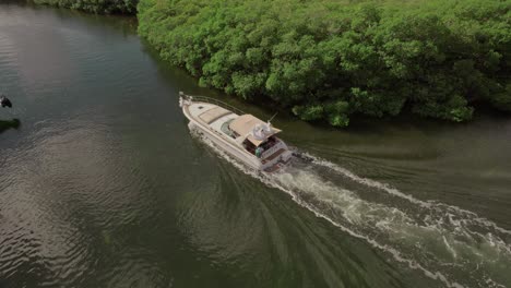 Drone-shot-4K-of-a-boat-in-water,-Cancun,-Tulum,-Playa-del-Carmen,-Mexico