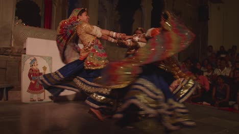 Young-women-enjoying-dancing-together-in-traditional-clothing,-slow-mo