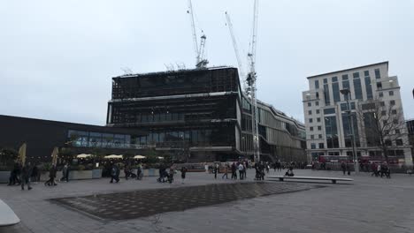 View-Across-Granary-Square-In-Kings-Cross-With-Large-Construction-Works-Building-In-background-On-December-Overcast-Day