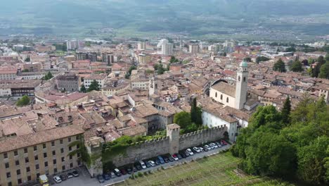 Rovereto-township-and-rooftops,-aerial-drone-view