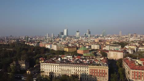 Milan-skyline-during-sunset,-aerial-view