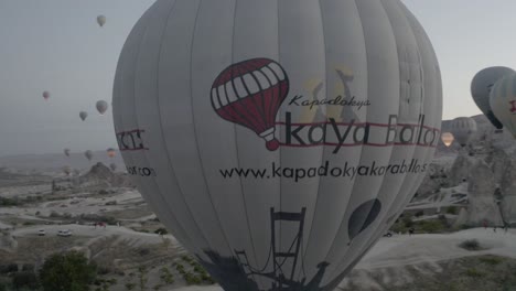 Aerial-view-turkey-in-Cappadocia-hot-air-balloon-close-up-shot-in-Tourists-having-fun-in-the-balloon