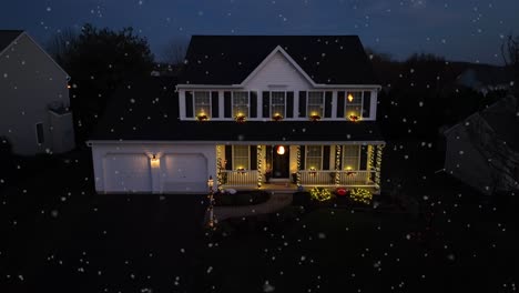 Snow-flurries-falling-on-American-home-decorated-with-Christmas-Lights-at-night-during-December-snowfall
