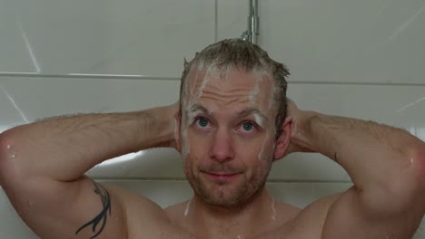 36-year-old-caucasian-male-put-soap-in-hair-and-face,-then-shower-it-off