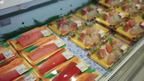 Sashimi-and-Sushi-on-sale-in-Japanese-Market,-Freshly-Caught-from-Seaside-Town