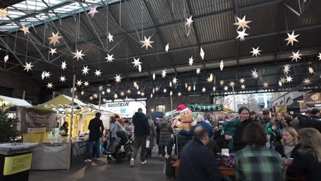 POV-Walking-Through-Past-People-At-Canopy-Market-During-Christmas-In-December-At-Kings-Cross,-London