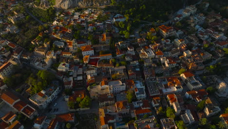 Beautiful-pan-up-reveal-aerial-shot-of-the-Acropolis-from-old-town-Athens