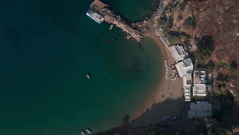 Pan-down-aerial-shot-over-beautiful-blue-Rhodes-sea