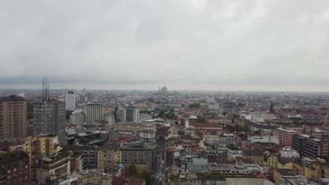 Panoramic-aerial-view-of-Milan-with-rainy-clouds-above