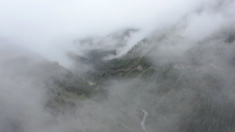 Flying-Through-The-Fog-And-Clouds-Over-The-Mountains,-Forest-And-Valley-In-Siguniangshan,-Xiaojin,-Sichuan,-China