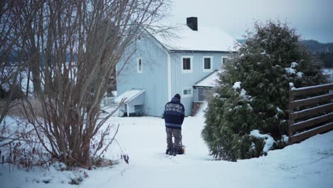 Man-Clearing-The-Driveway-Using-Snow-Blower-During-Winter