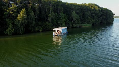 House-boat-floating-on-a-lake-in-Brandenburg,-Germany