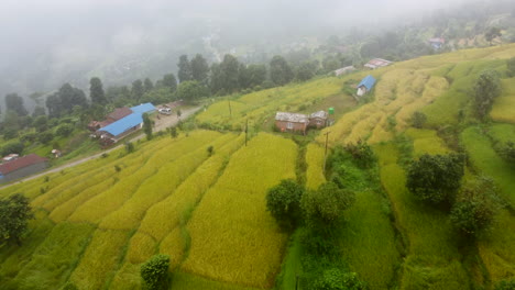 Rice-Terraces-And-Houses-On-The-Mountain-Hills-On-A-Foggy-Morning