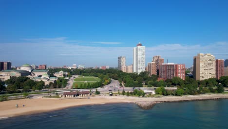 City-Beach-With-Green-Trees-and-Apartment-Buildings
