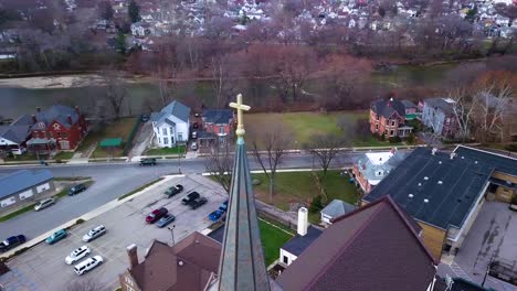 Aerial-view-circling-Logansport-church-steeple-cross-overlooking-Indiana-small-town-community