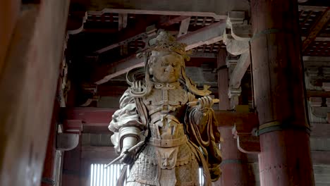 Looking-Up-At-Komokuten,-One-Of-The-Pair-Of-Guardians-In-The-Daibutsuden-At-Nara