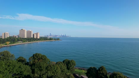 Field-House-In-Lush-Green-City-Part-Next-To-Waterfront-And-Chicago-Downtown-Skyline-Drone