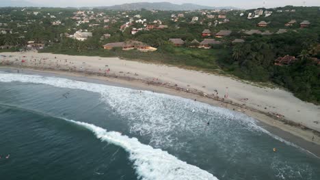 Drone-fly-above-La-Punta-Zicatela-beach-Puerto-escondido-Oaxaca-coastline-Mexico