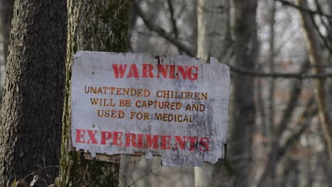 Mysterious-distressed-sign-warning-of-experimental-medical-procedures-on-children-in-remote-woodland-forest